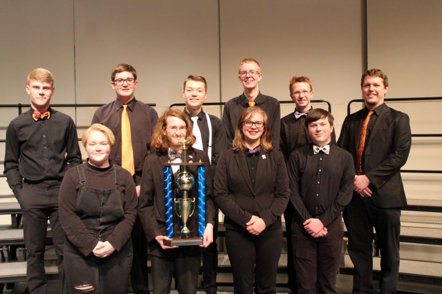 Academic Team poses for team photo with new trophy. 
