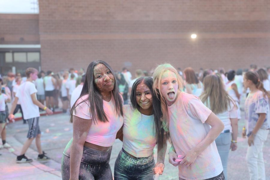 From left to right, sophomore Taylor Armstrong, freshman Tarryn Armstrong, and  freshman Karsten Katzer share a fun moment at the GJHS Color Dance on Saturday, Aug. 27. The dance was the first big event of the year for Tigers students.