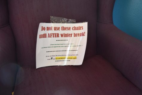 Signs hang in the chairs in the GJHS library, preventing students from sitting there.