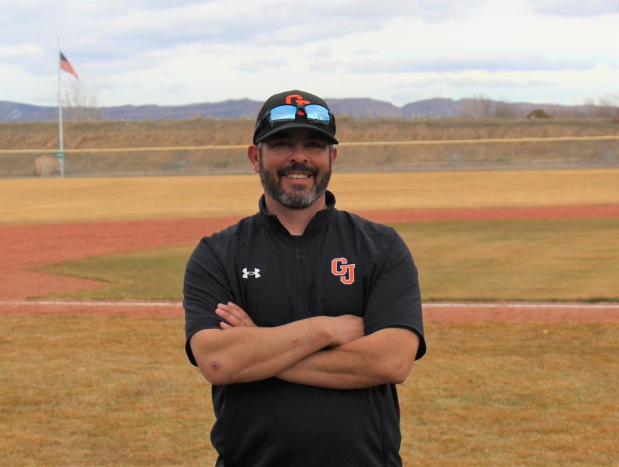  Si Espinoza, the head baseball coach at GJHS standing inside the canyon view baseball field. 