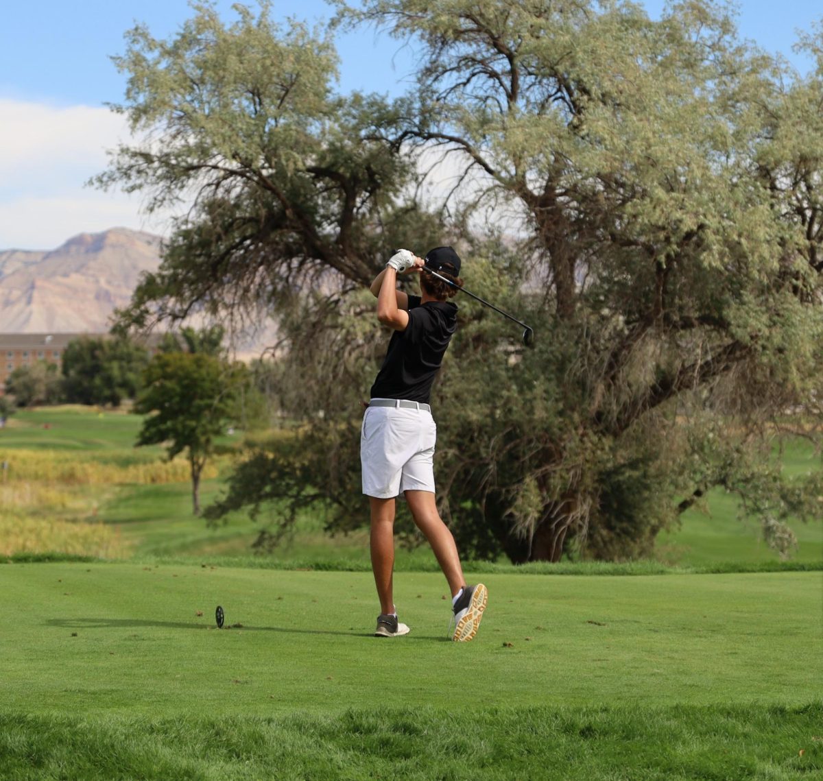 GJHS junior Jack Kaul watches his shot off the tee at Bookcliff Country Club at regionals on Sept. 20. 