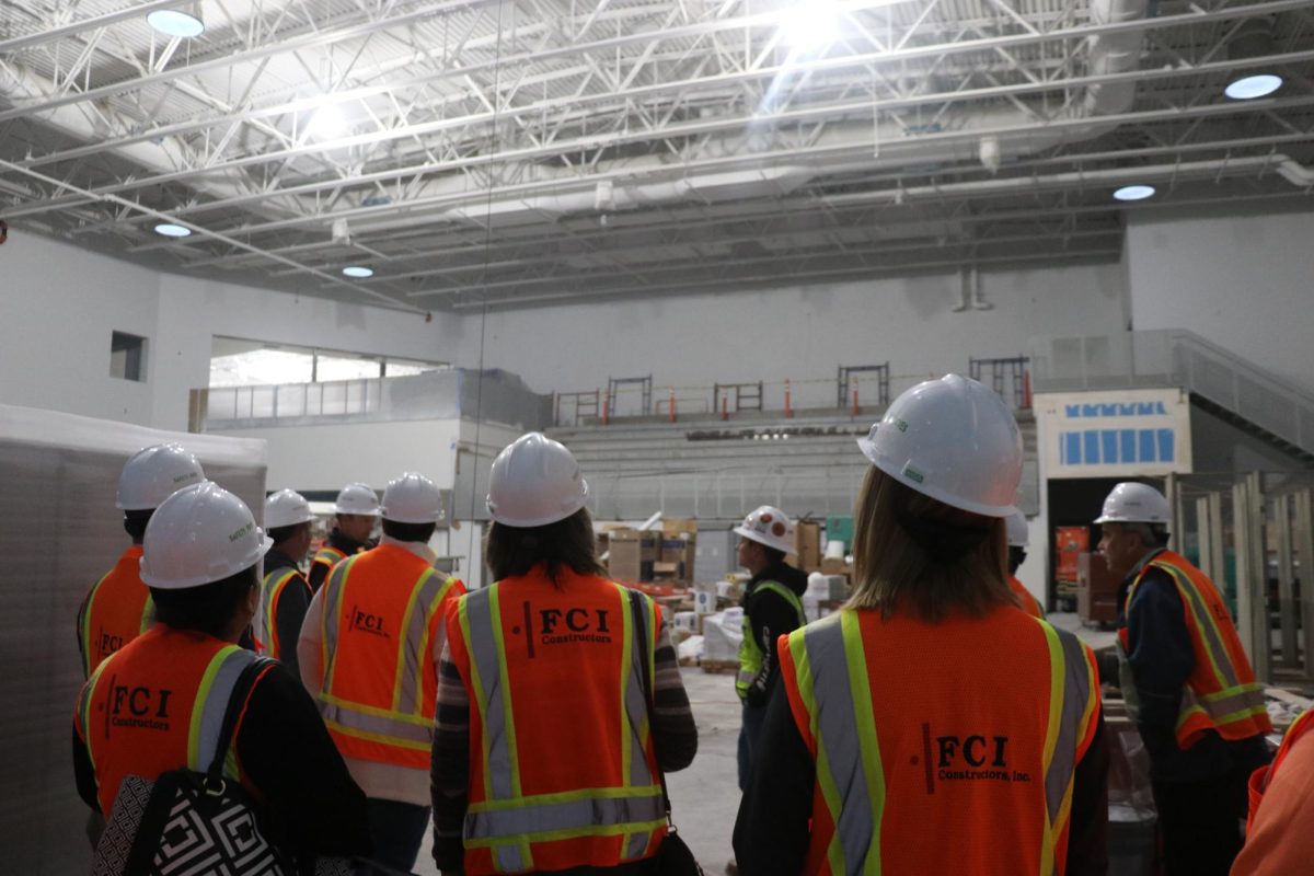 Pictured above is the new main gym filled with teachers and interested community members observing the construction. 