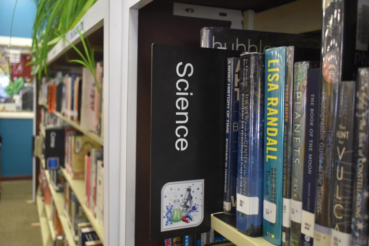 The+science+book+section+of+our+GJHS+library+includes+books+on+space+and+physics.+New+School+Board+member%2C+Barbra+Evanson+pushes+to+include+the+Bible+with+these+books.