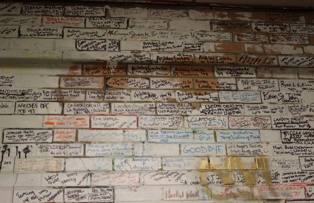 Signed bricks in Grand Junction High Schools Theater Workshop depict the rich history of the department.