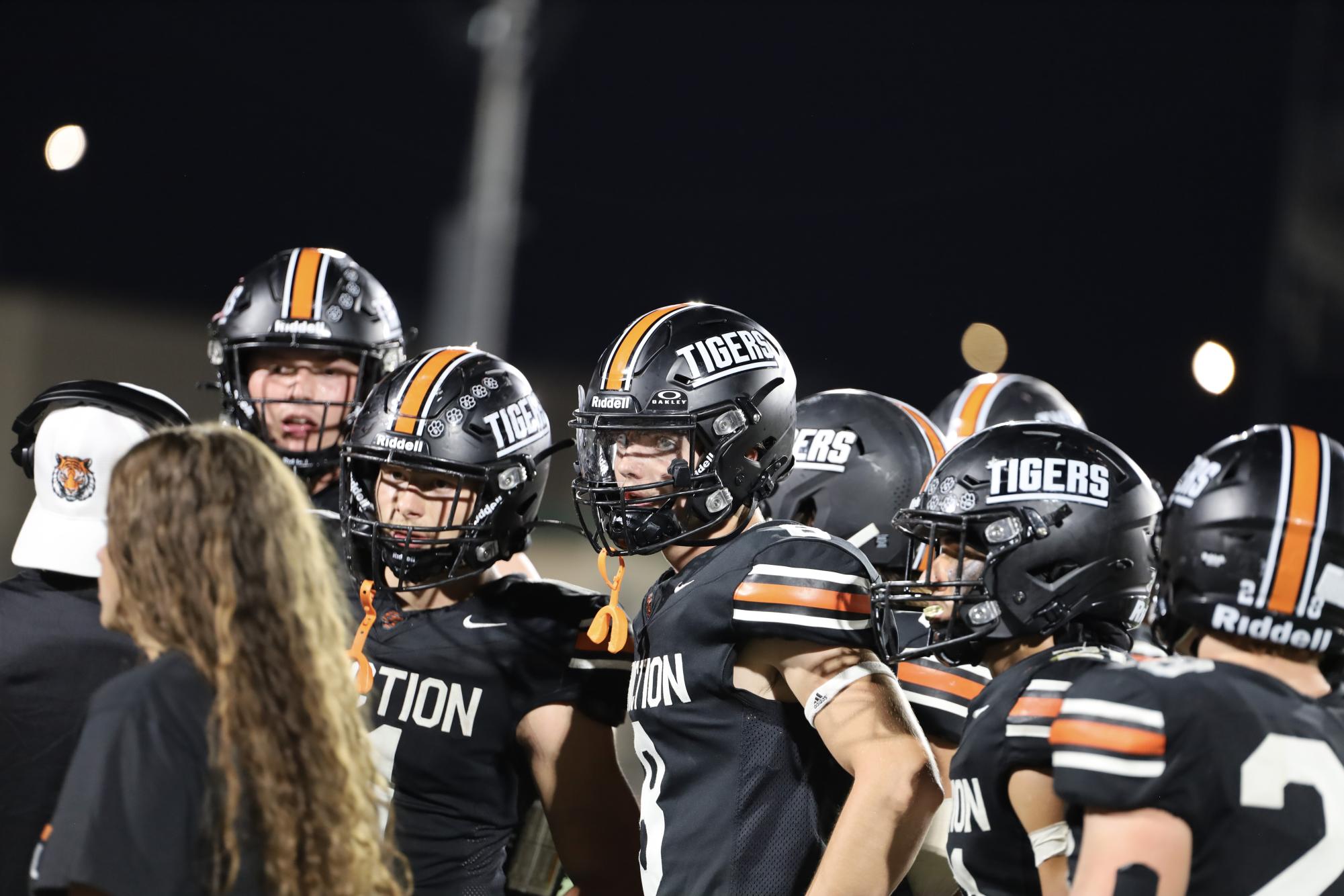 GJHS football players receive instructions from a coach on the sidelines during the teams 35-14 win over Central. The tigers face rivals Fruita Monument High School on Friday, Sept. 20.