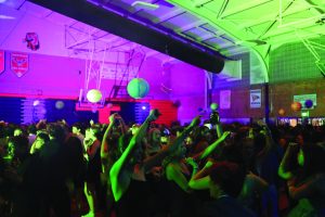 Students dance and mingle at GJHS' 2023 homecoming, themed Night in the Cosmos, the last in the old building. This years homecoming theme is Aladdin.