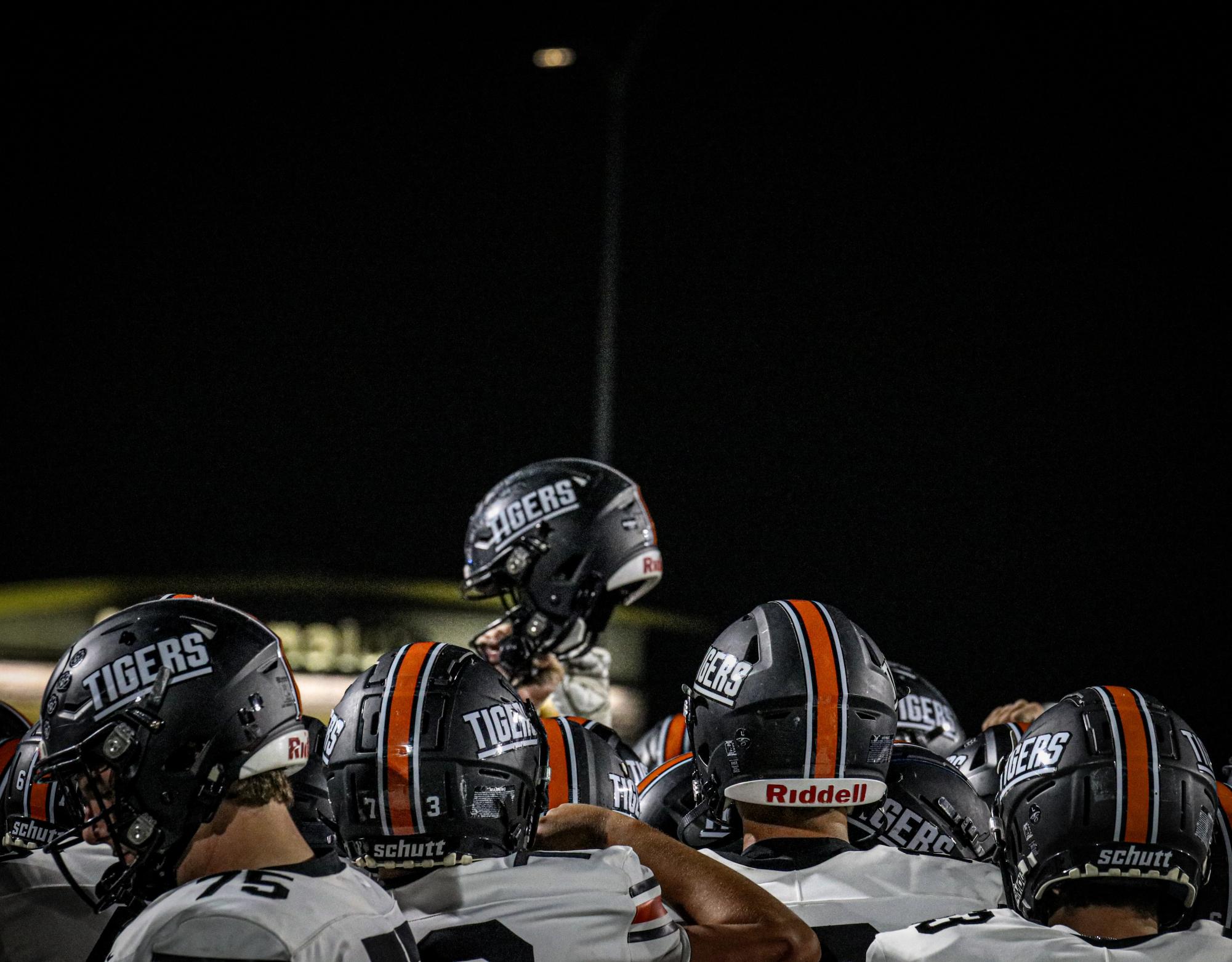 Grand Junction High School football players lift their helmets in the air to celebrate after beating local rivals Fruita Monument earlier this season. The Tigers are now 8-1 and can qualify for the state playoffs with a win in the season finale on Halloween night in Stocker Stadium. 