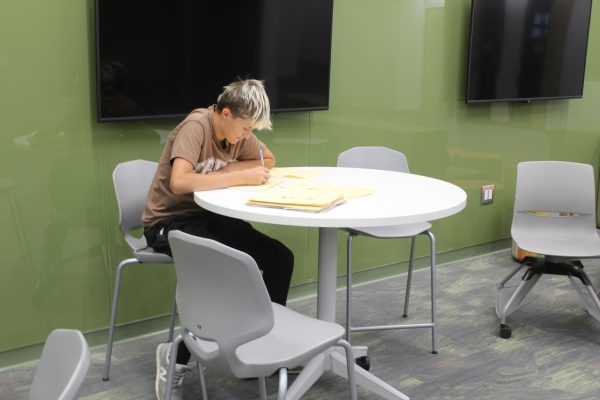 GJHS sophomore Camron Rogers sits on a new chair in the hallway. These new chairs are common in the new school building.