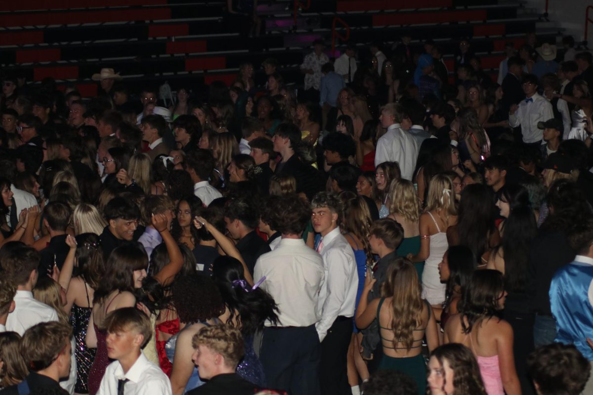 The homecoming dance saw a record attendance of an estimate of 1200 students.