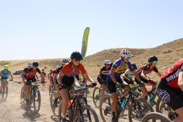 A GJHS mountain biker (center) passing the starting line during a race. State will be held in Glenwood on Saturday Oct. 19 to Sunday Oct. 20.