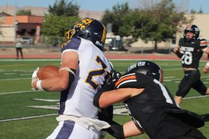 GJHS football player tackles a Rifle High School player. The football team will be playing in playoffs this Sunday, Nov. 10 at 1 p.m. in Stocker Stadium (moved from Nov. 9 to 10)