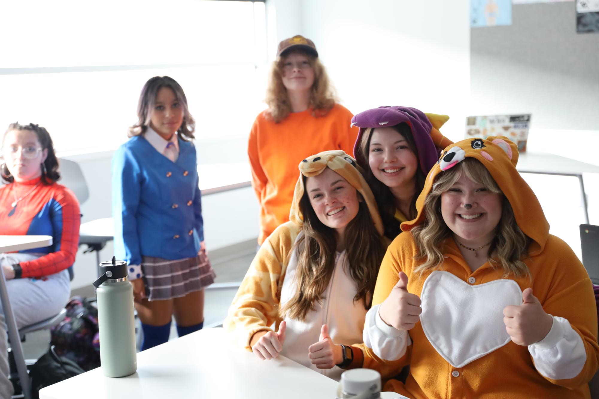 Students gather in their Halloween costumes on Thursday, Oct. 31. Some students choose to participate in wearing costumes to school the day of Halloween and others opt out. 