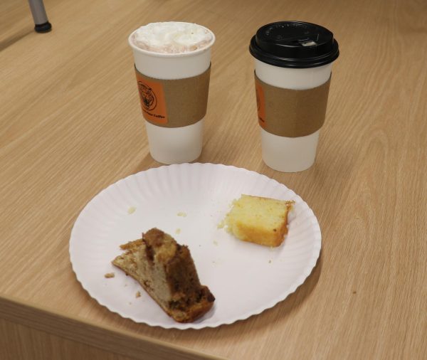 The selection of food and drinks reviewed by Eli Schultz and his partner Aaron Gomez. Both agreed that the orange cake is the best choice at the Roar & Pour Coffee shop.