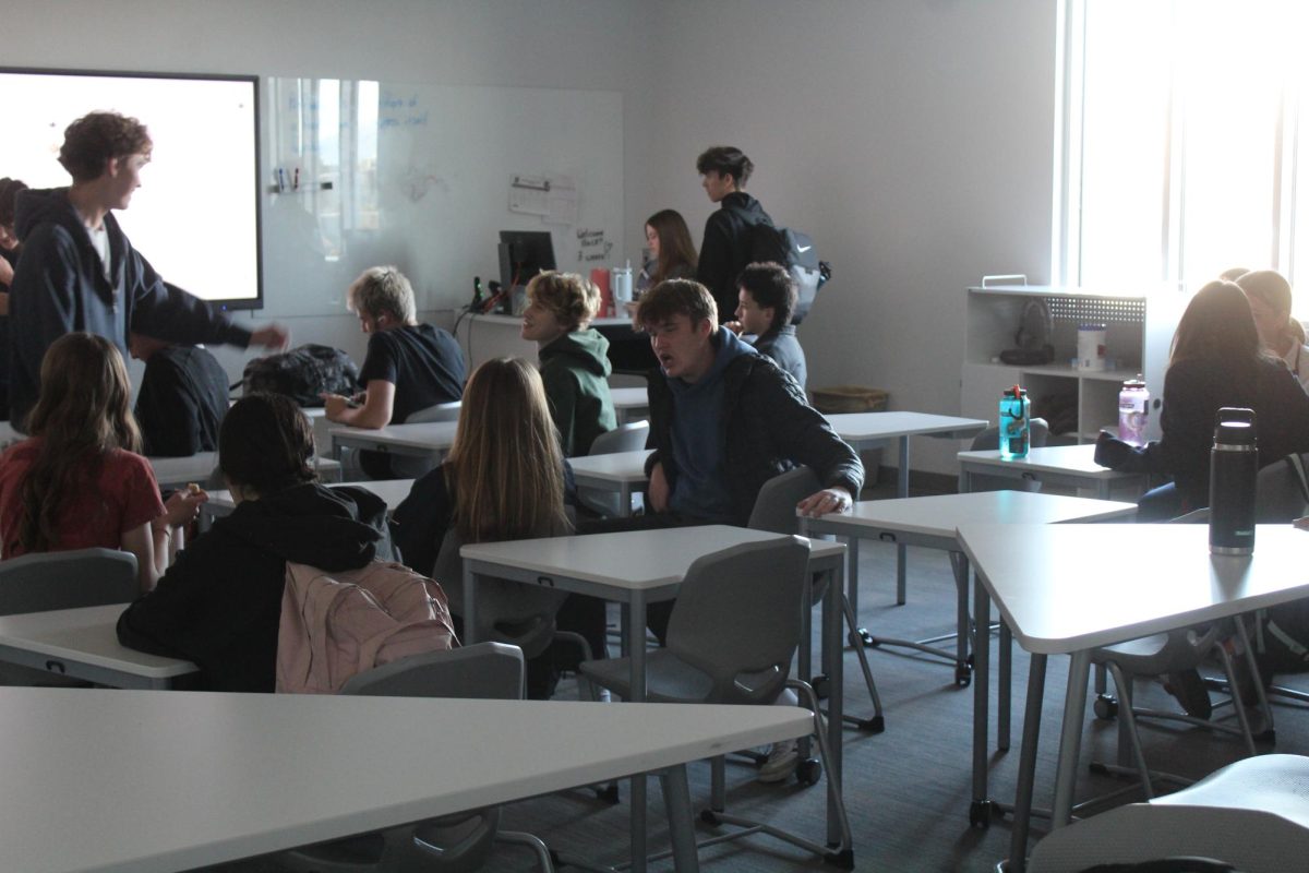 Here are some of the StuCo staff members talking about a future project during their class period.