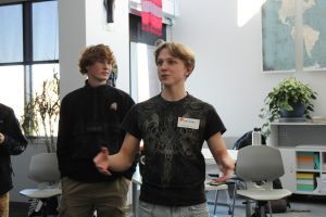 GJHS grad Dean Withers visits teacher Justin Whiteford's classroom and tour the new building. He participated in a debate activity with students and engaged with the class.