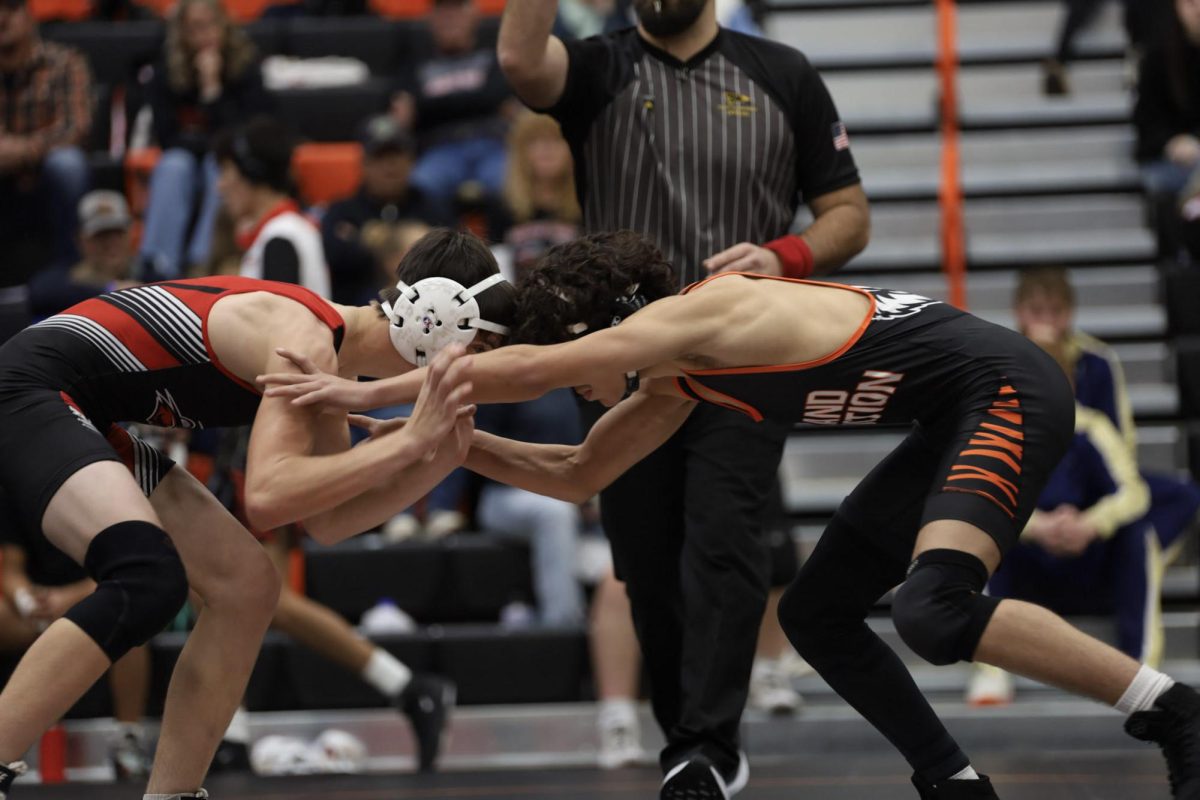 GJHS freshman wrestler Carson Hembree (right) and a North Fork high School wrestler (left).