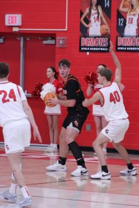 GJHS junior basketball player Andrew Henderson looks for a teammate while playing Glenwood High School. Henderson is one of the leading players on this year’s Tigers team.