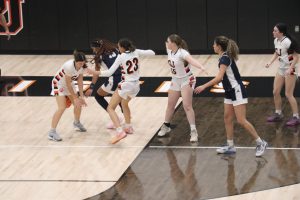 GJHS senior varsity player Maycie Childs and junior varsity player Ella Alderman defend against Air Academy, who are ranked #1 in state.