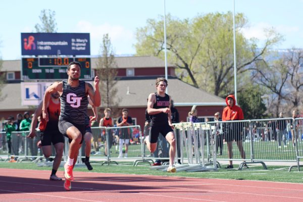 GJHS senior Mason Anderson finishes his sprint during the 100 meter dash. This was pictured at the Frank Woodburn Invite where GJHS placed second. 