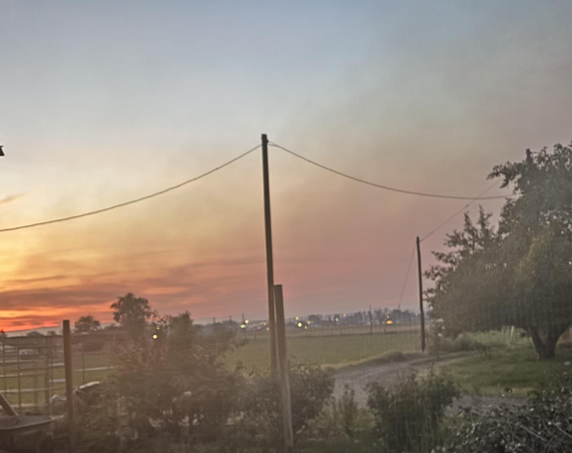 Smoke from the Turner Gulch Fire hovers over Grand Junction, blocking the view of the Bookcliffs. A dark haze can be seen filling the Grand Valley.