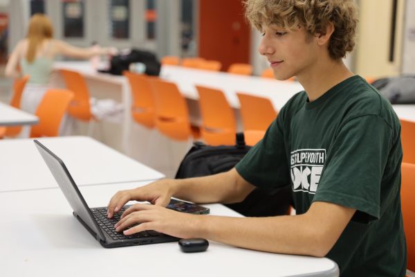 GJHS senior Aaron Gomez-Farinacci works on his classwork on his Chromebook. Chromebook chargers are available in the main office. 