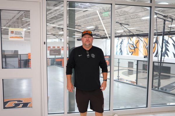 GJHS football coach Landon McKee stands next to the gymnasium. This is his fifth season as the Tigers’ coach, and McKee has a GJHS coaching record of 17 wins and 28 losses as of Sept. 16.
