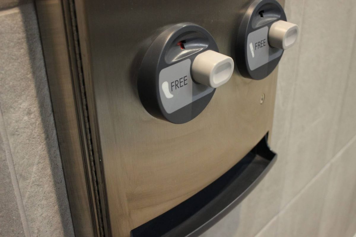 A feminine hygiene product dispenser is mounted on the wall in a 2nd floor bathroom at GJHS. Not all bathrooms in the school have them, and the dispensers in the remaining bathrooms aren’t adequately stocked. 