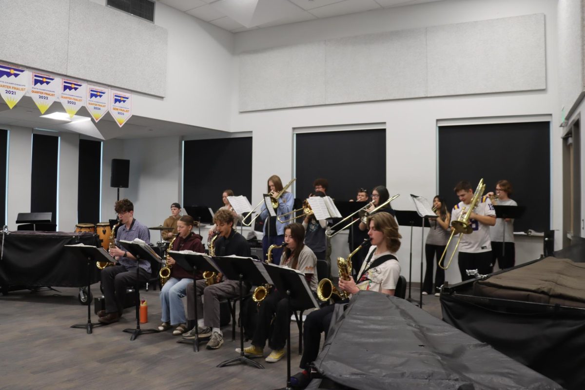 Jazz I rehearses one of their songs in the band room. Many of the songs they will play at Spring Swing have been in their folders since the start of the year.