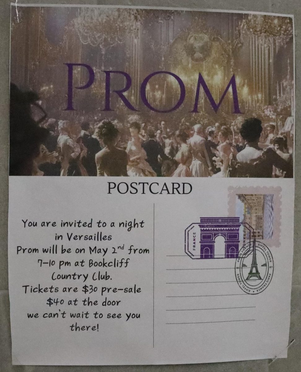 A poster hanging in the main first-floor hallway, advertising this year's theme: A Night in Versailles. Prom will take place on May 2 at the Bookcliff Country Club.