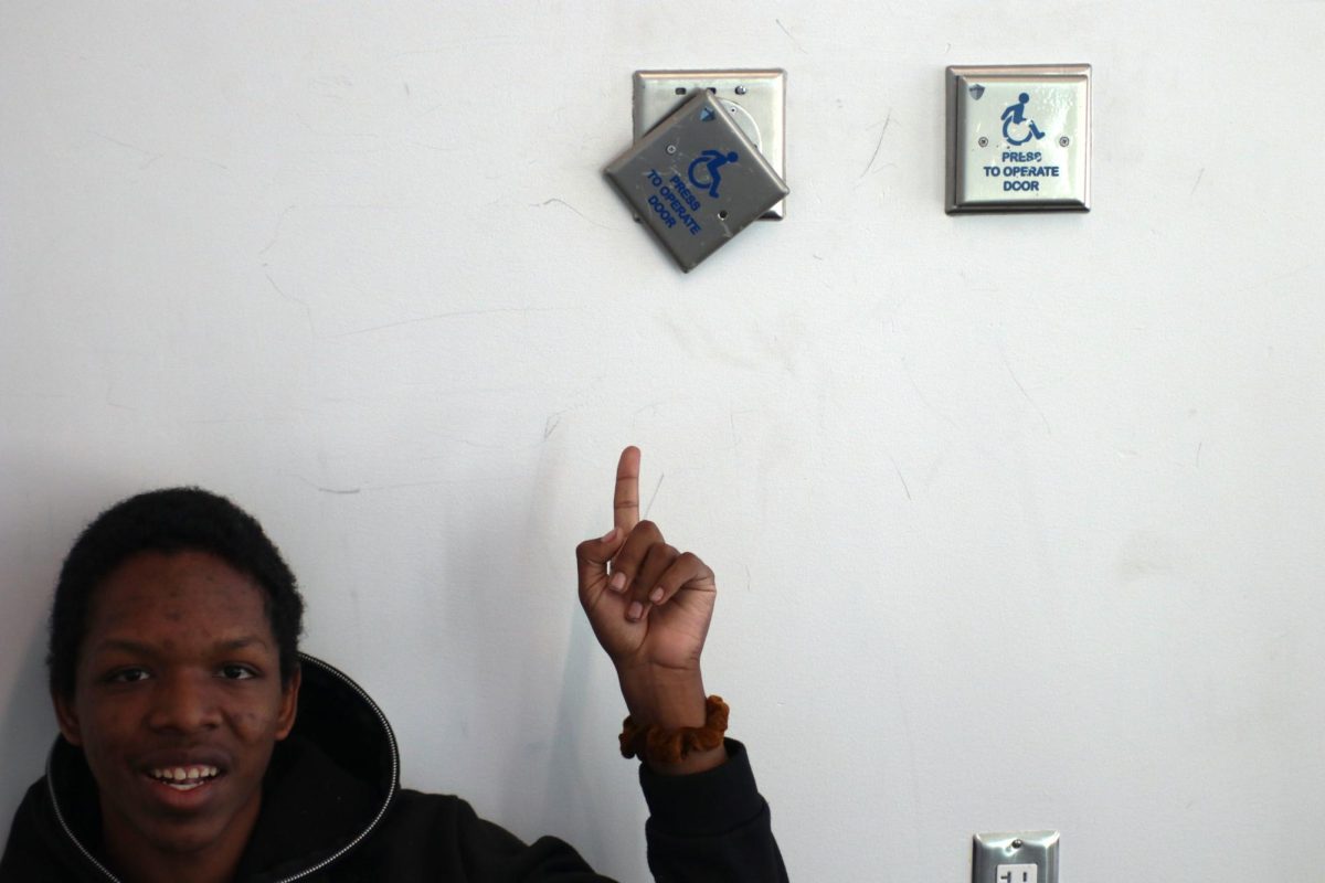 GJHS junior Dominick Jackson points at a broken door activator. This is located at the bus loop exit in the band hallway.